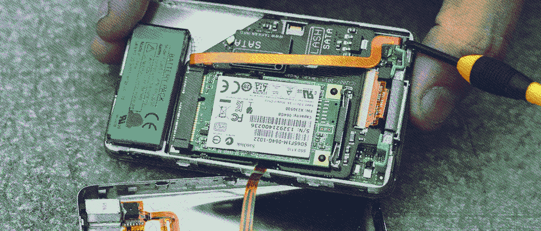 iPod Classic being opened, the internals reveal an already upgraded device